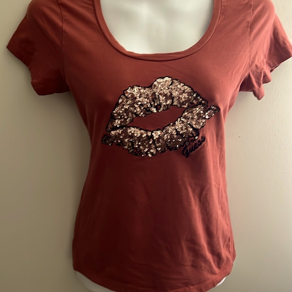 Guess women’s top with sequin lips size medium